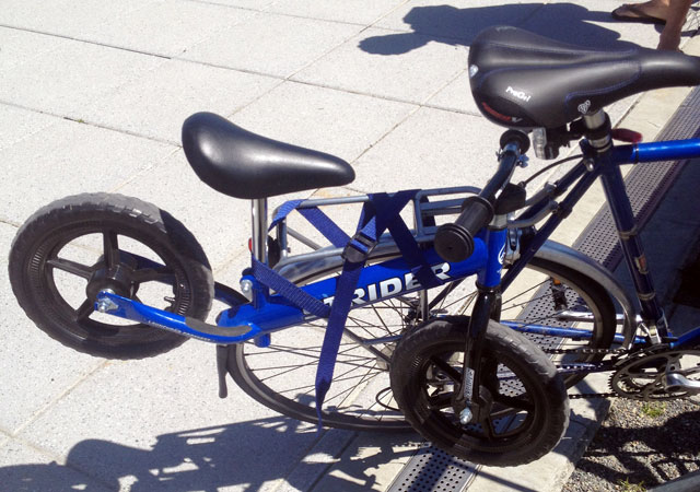 Balance bike on regular bike's rear rack