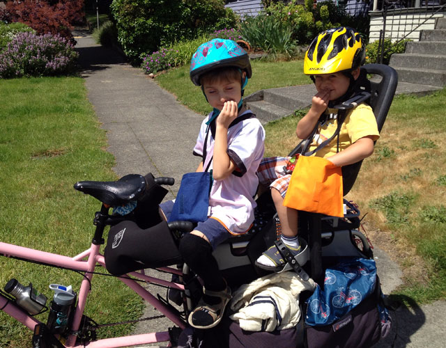 Kids feeding with feed bags