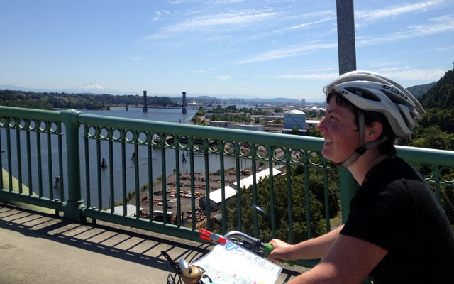 Peeking at Katie's map on the St. Johns Bridge