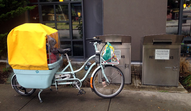 Returning library books from the frame-mounted front rack