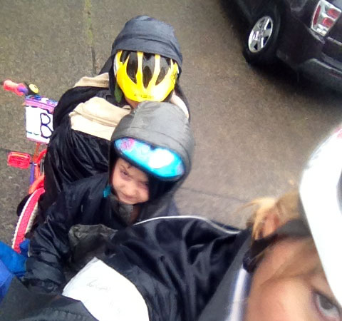 Hoods halfway on helmets