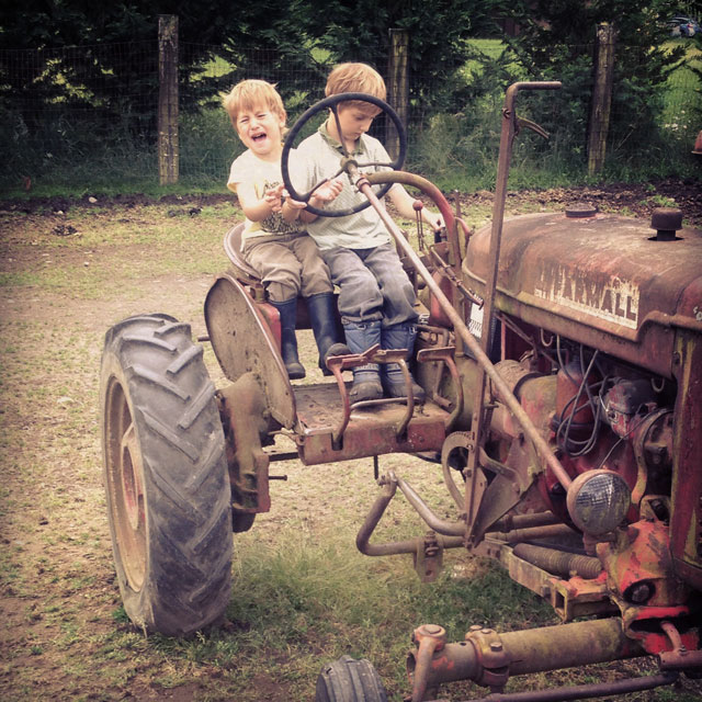 Two on a tractor, not happily