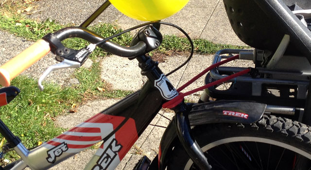 Kid bike secured with bungee cord