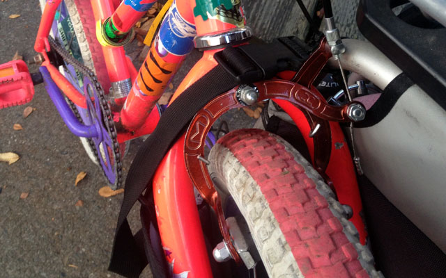 Buckle over kid bike fork