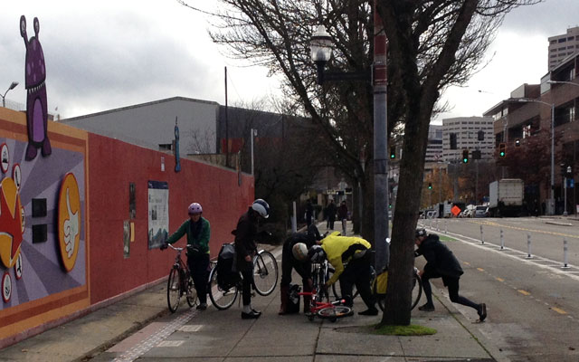 Critical Lasses fix a bike