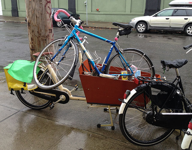 Clever Cycles rental bakfiets holding my road bike